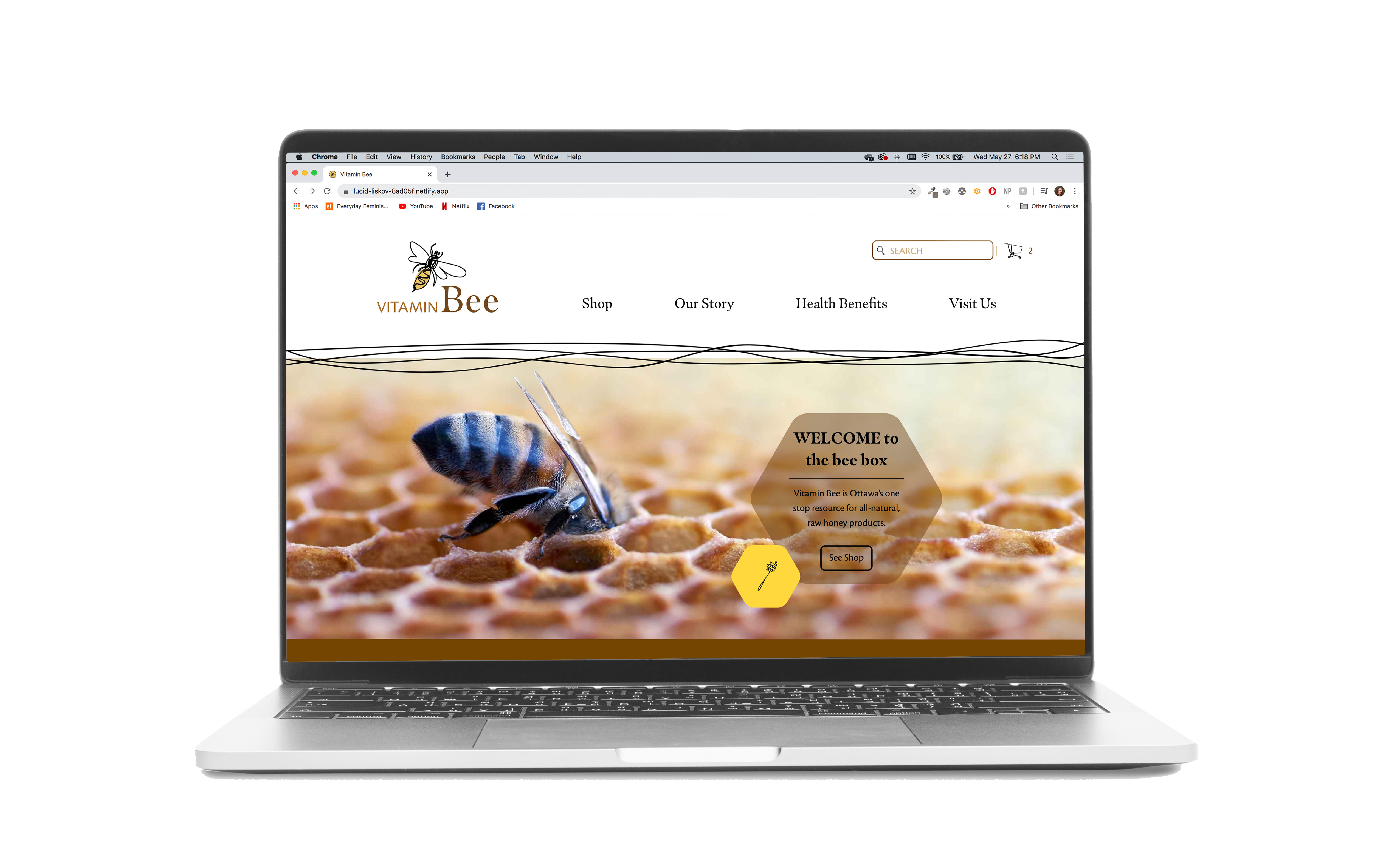A laptop showing the Vitamin Bee homepage.